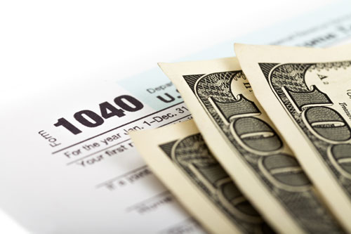 1040 tax return with hundred dollar bills